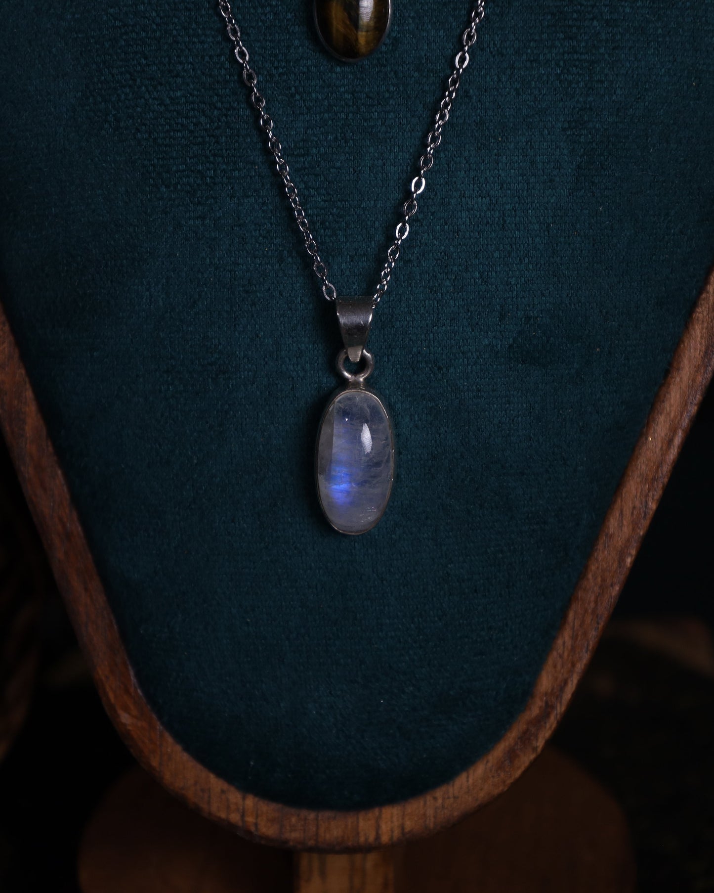 Moonstone or tiger's eye pendant in sterling silver setting