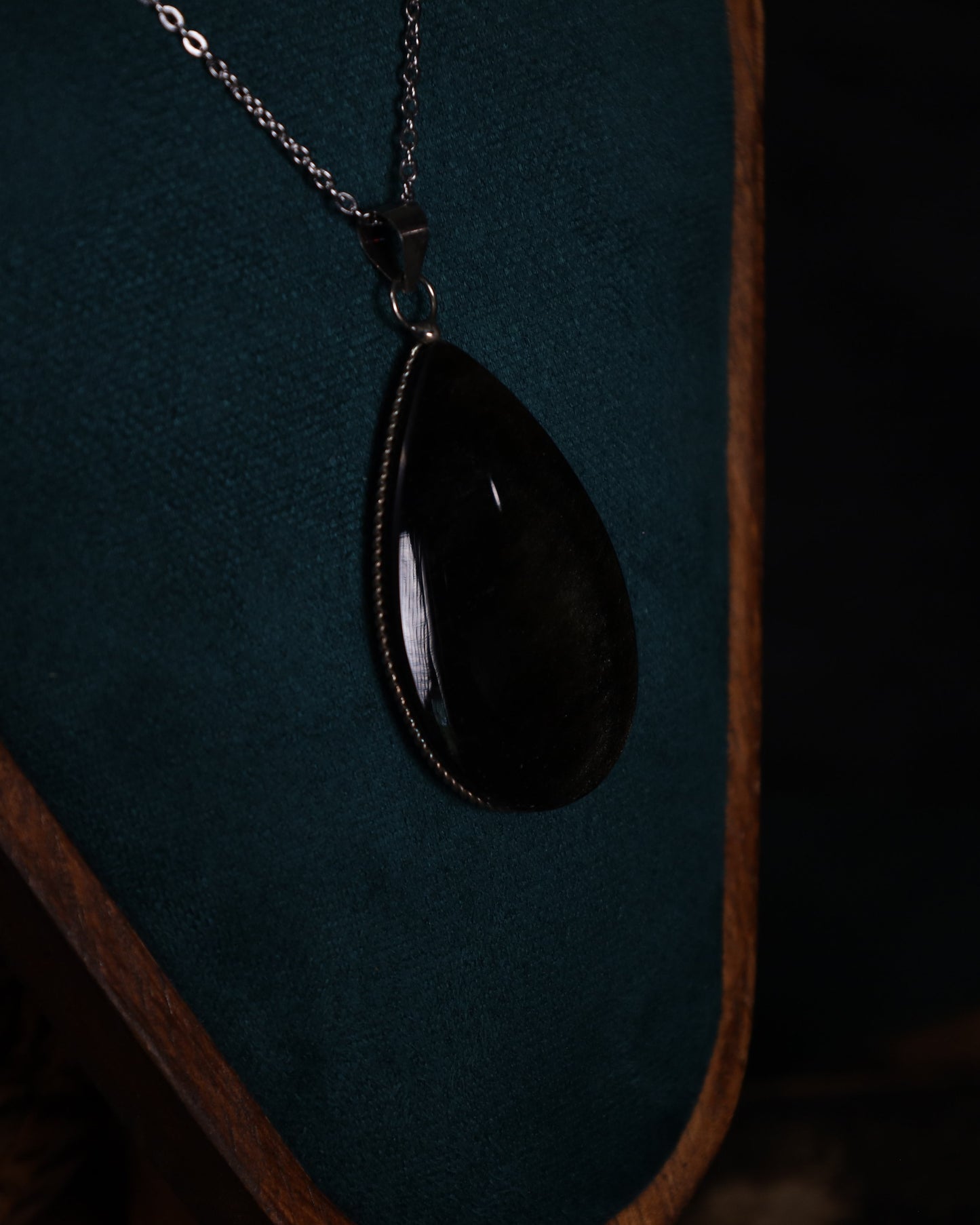 Gold obsidian pendant with genuine silver setting